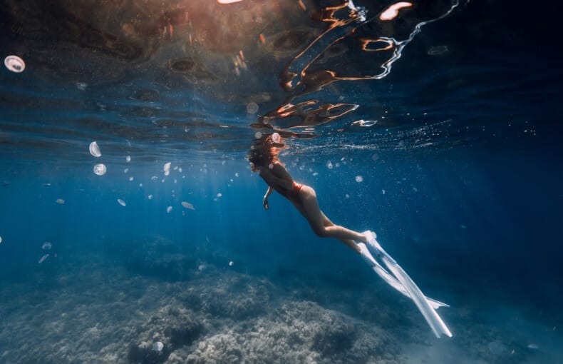 bigstock-Woman-Freediver-Swim-With-Jell-402398219 (1)